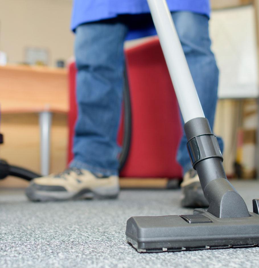 Close-up of a carpet being vacuumed