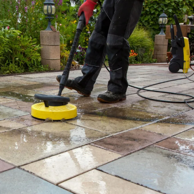 Paving being pressure washed